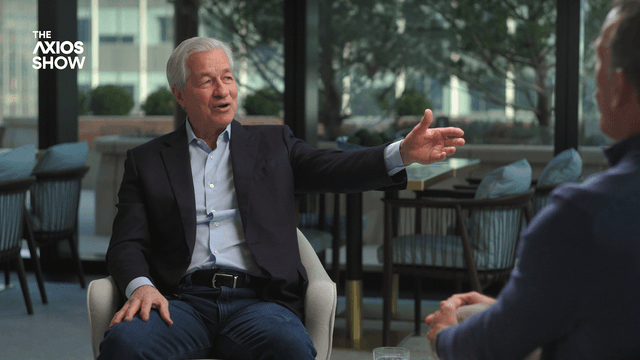 Jamie Dimon gestures while speaking with Jim VandeHei on The Axios Show