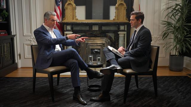 Gavin Newsom gestures to Alex Thompson while being interviewed on "The Axios Show"