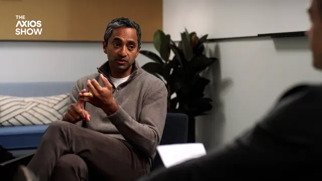 Man sitting in chair counting on his fingers.