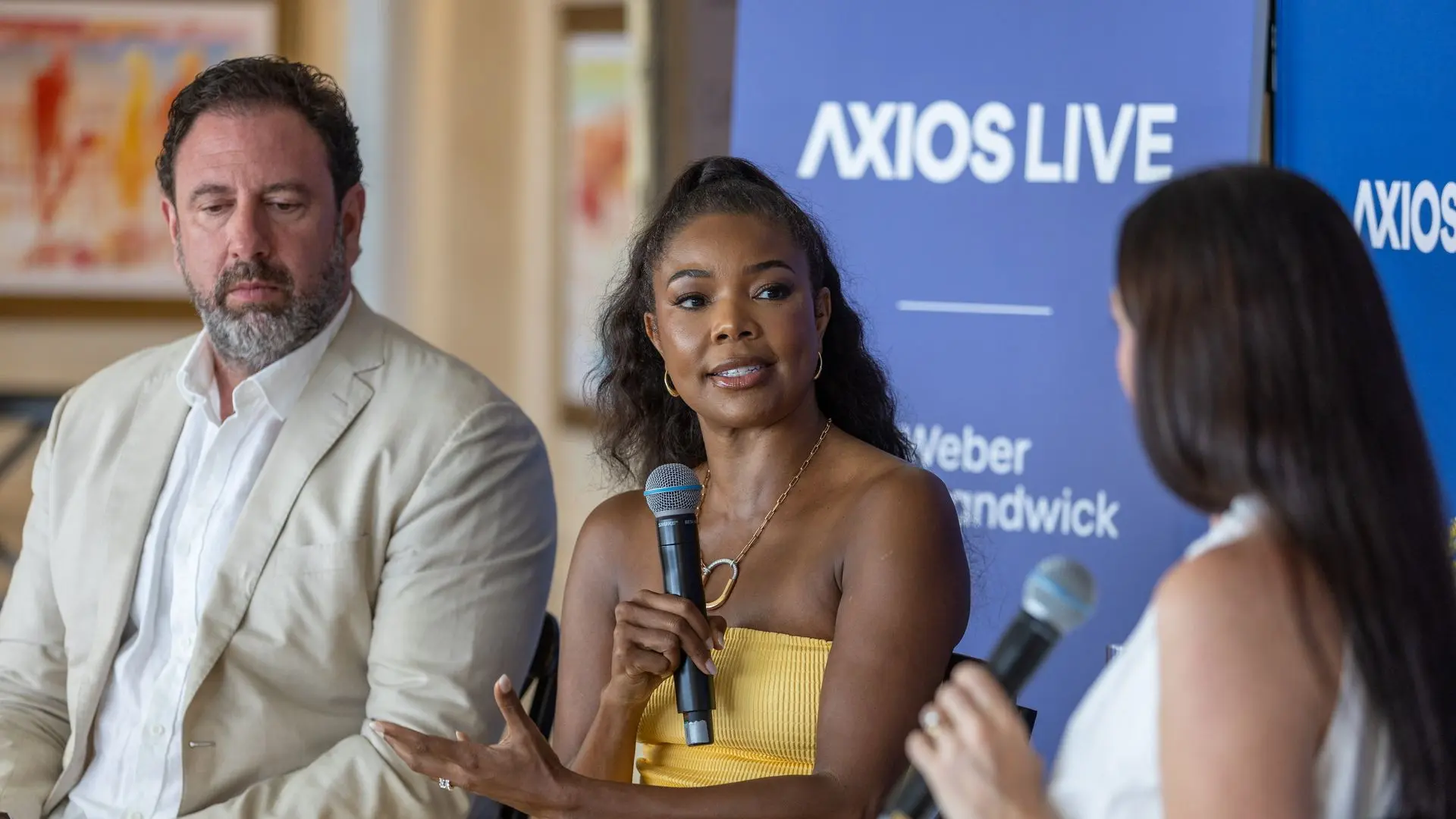 Gabrielle Union and Peter Micelli talk with Axios' Eleanor Hawkins on stage.