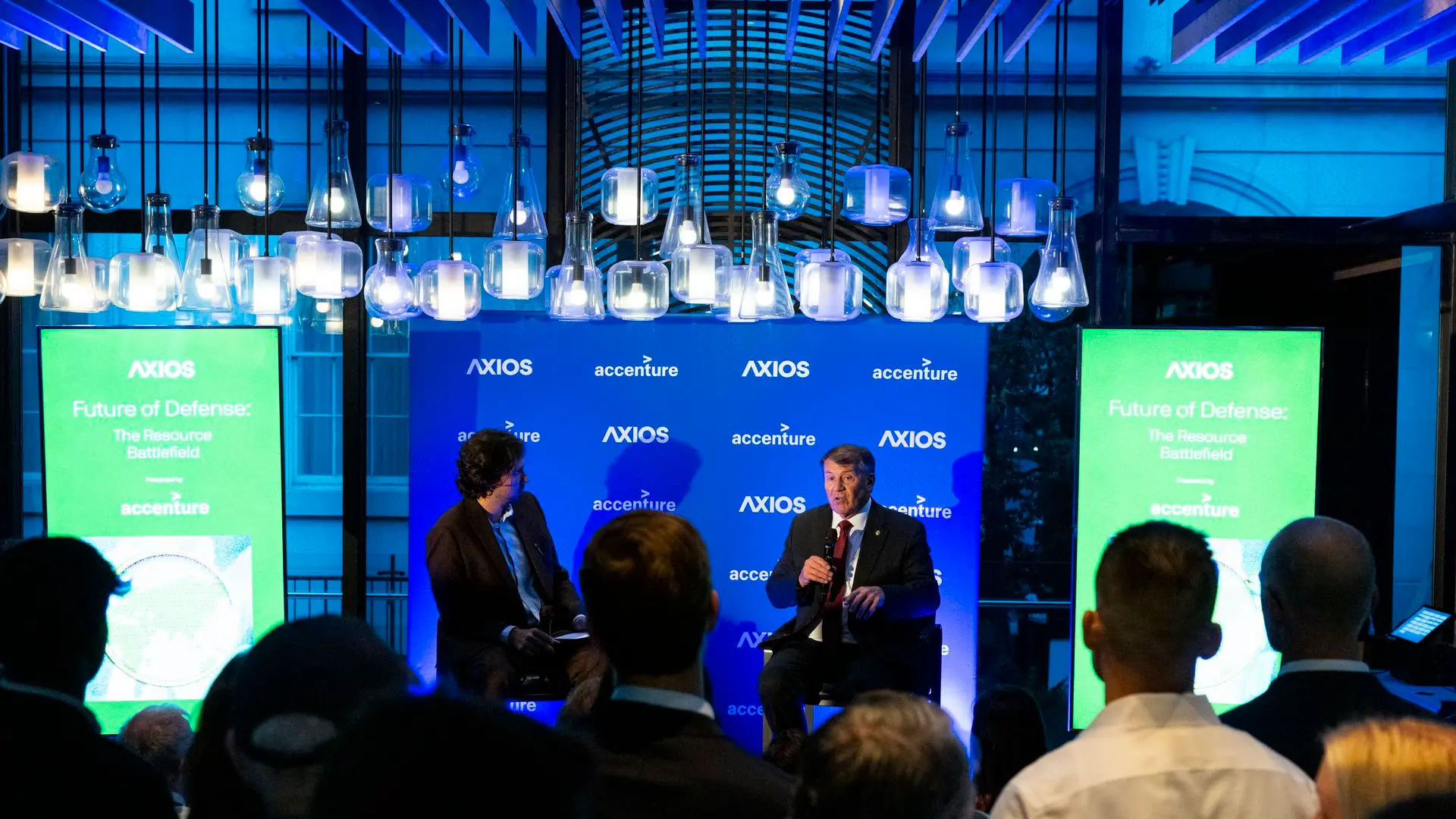 Axios' Colin Demarest on stage in conversation with Sen. Rounds.