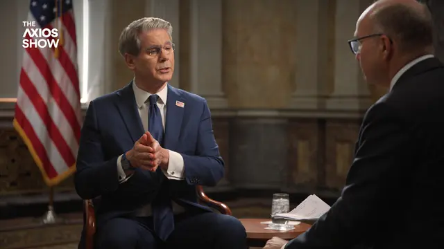 Scott Bessent gestures while speaking with Mike Allen on The Axios Show